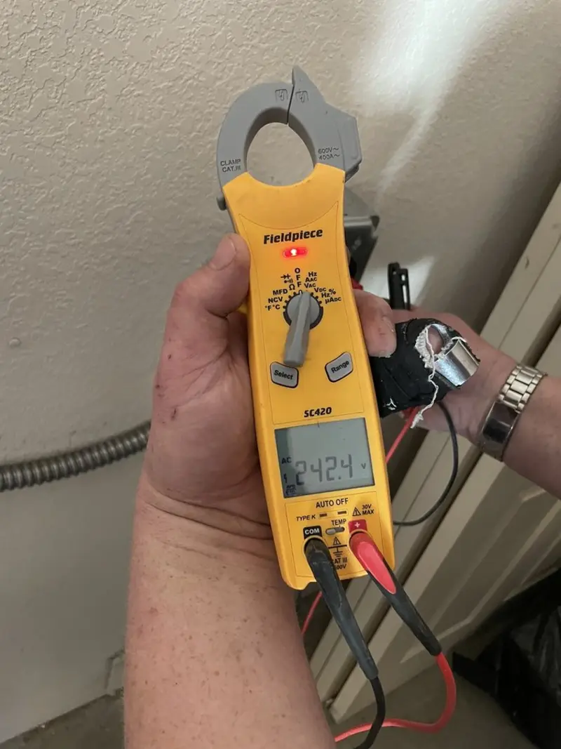 Voltage testing with clamp meter during Outlet Installation in Meadowbrook